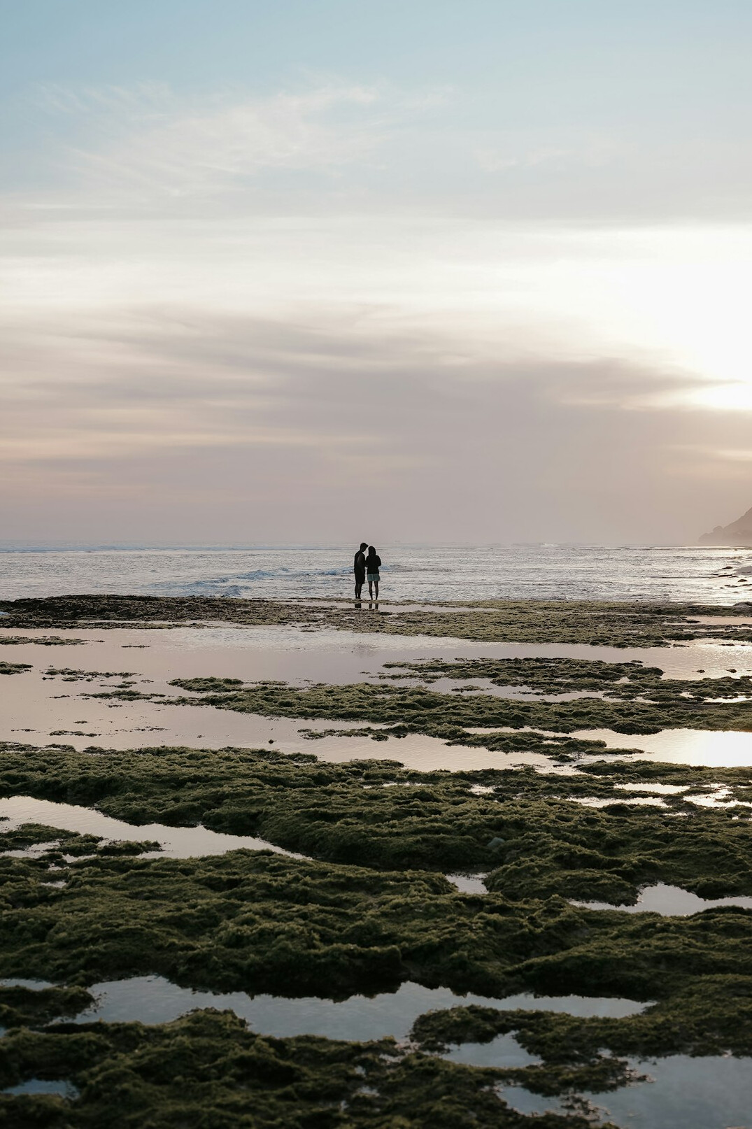 romantic couple walking beach